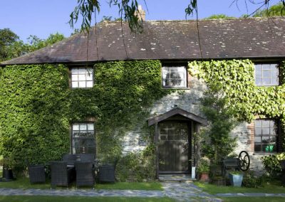 Honeysuckle Cottage (on the corner), Bramble's Front Door and Bramble Cottage (to the right of the door)